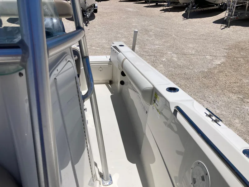 Slide: The Image of 2012 Sailfish 2180 boat interior, showing side rail and seating area. - 12