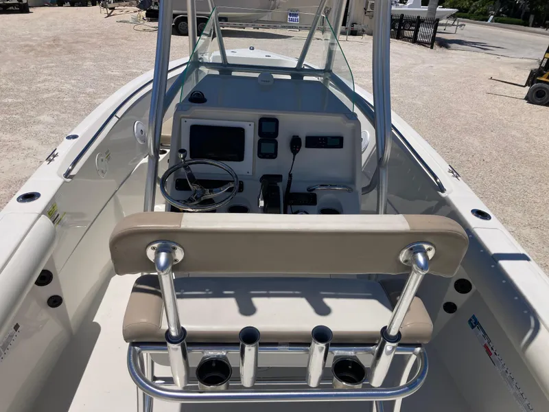 Slide: The Image of 2012 Sailfish 2180 boat interior with steering console and seating. - 6