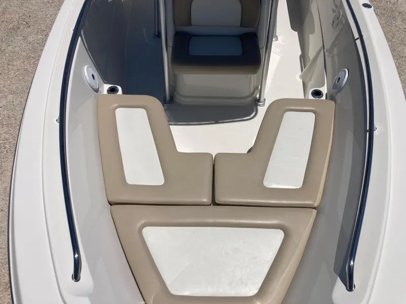 Slide: The Image of Bow seating area of a 2012 Sailfish 2180 boat with cushioned seats. - 9