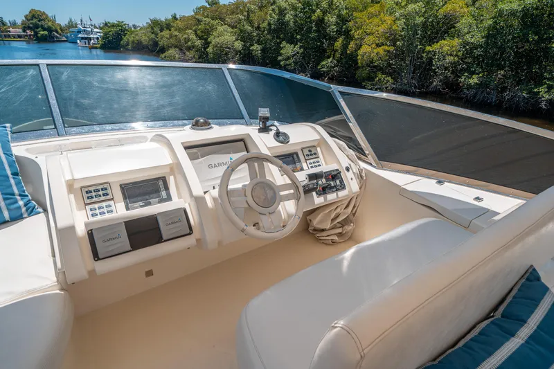 Slide: The Image of Cockpit of 2010 Azimut 75 Fly yacht with modern navigation equipment and plush seating. - 17