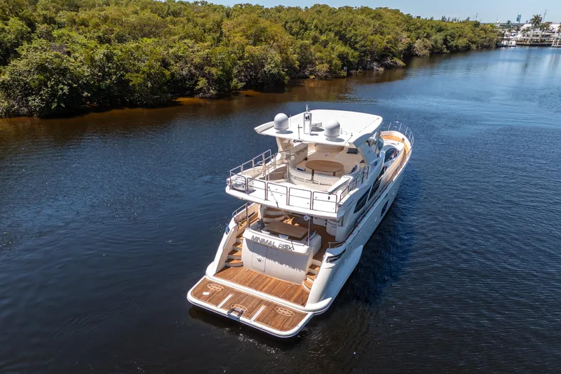 Slide: The Image of Luxurious 2010 Azimut 75 Fly yacht cruising on a serene river. - 2