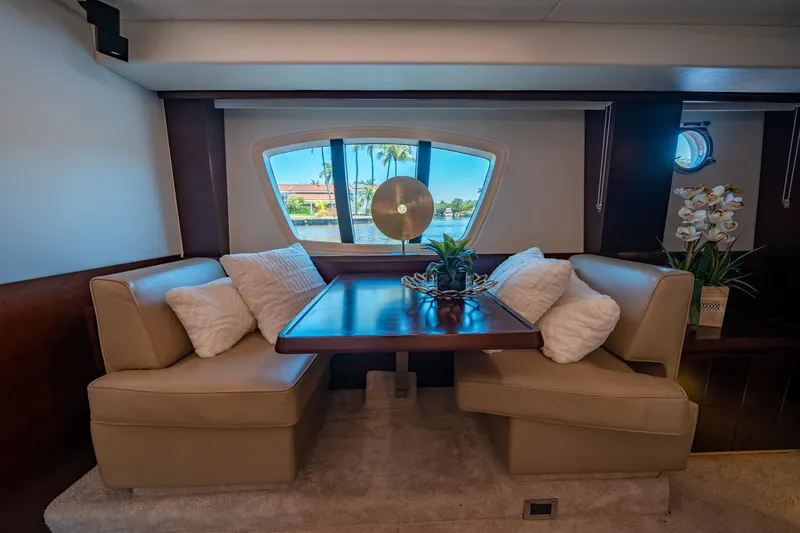 Slide: The Image of Luxurious interior of 2010 Azimut 75 Fly yacht with elegant dining area and scenic window view. - 37
