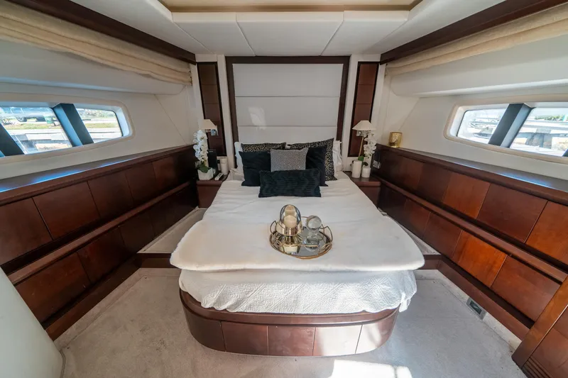 Slide: The Image of Luxurious bedroom interior of 2010 Azimut 75 Fly yacht with elegant wood paneling. - 40