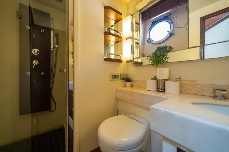 Slide: The Image of Luxurious bathroom on 2010 Azimut 75 Fly yacht with modern fixtures and porthole window. - 44