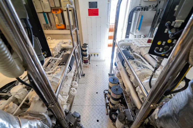 Slide: The Image of Engine room of a 2010 Azimut 75 Fly yacht, showcasing dual engines and mechanical components. - 47