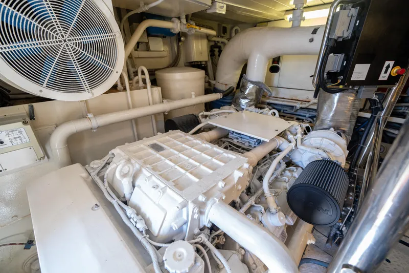Slide: The Image of Engine room of a 2010 Azimut 75 Fly yacht, showcasing mechanical components and ventilation. - 49