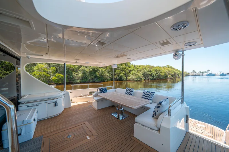 Slide: The Image of Luxurious 2010 Azimut 75 Fly yacht deck with elegant seating and scenic water view. - 8