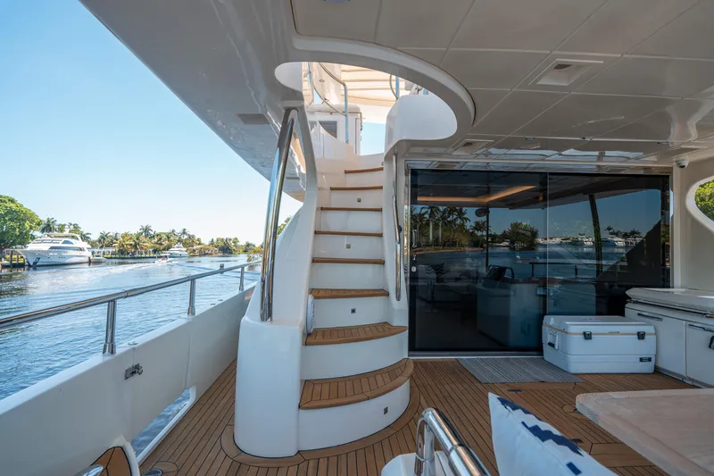 Slide: The Image of Luxurious 2010 Azimut 75 Fly yacht deck with elegant staircase and waterfront view. - 9