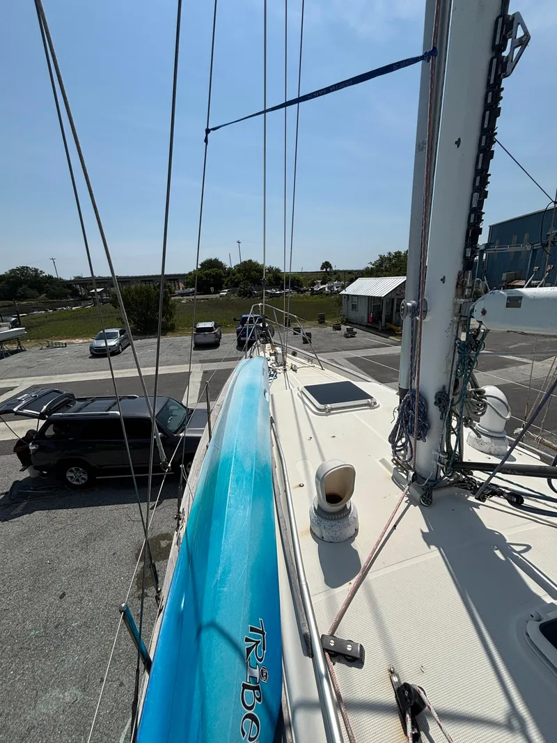 Slide: The Image of 1995 Pacific Seacraft Crealock 37 sailboat deck view, showcasing mast and rigging. - 14