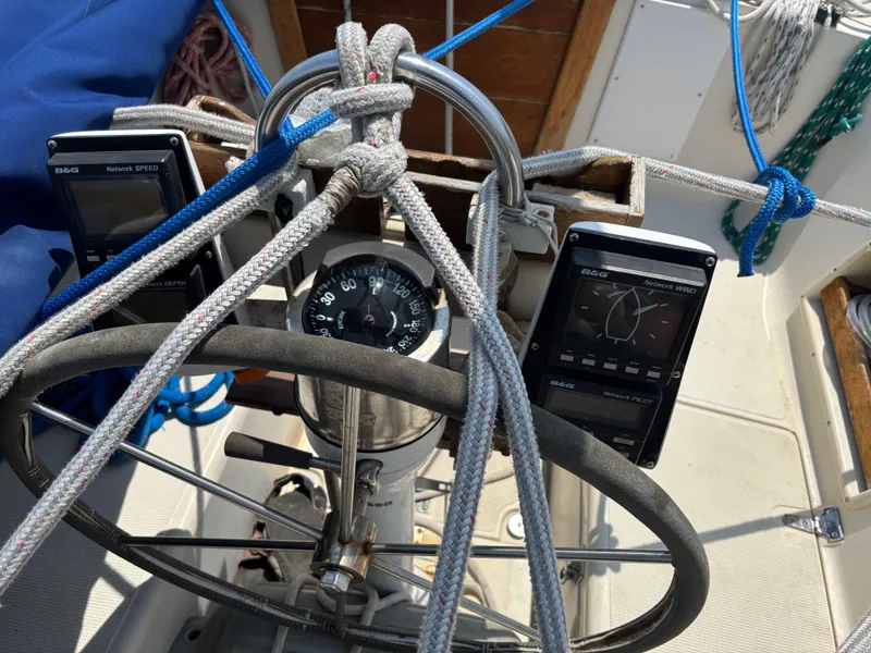 Slide: The Image of Steering wheel and navigation instruments on a 1995 Pacific Seacraft Crealock 37 sailboat. - 17