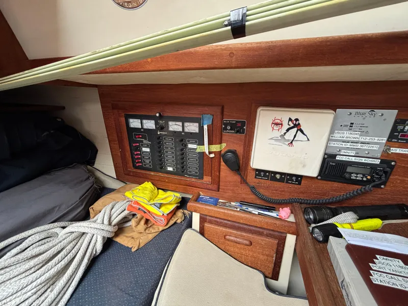 Slide: The Image of Control panel and equipment inside a 1995 Pacific Seacraft Crealock 37 sailboat cabin. - 28