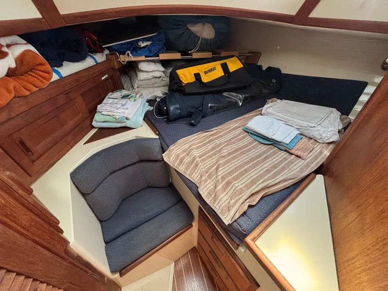 Slide: The Image of Cozy cabin interior of 1995 Pacific Seacraft Crealock 37 sailboat with neatly arranged items. - 35