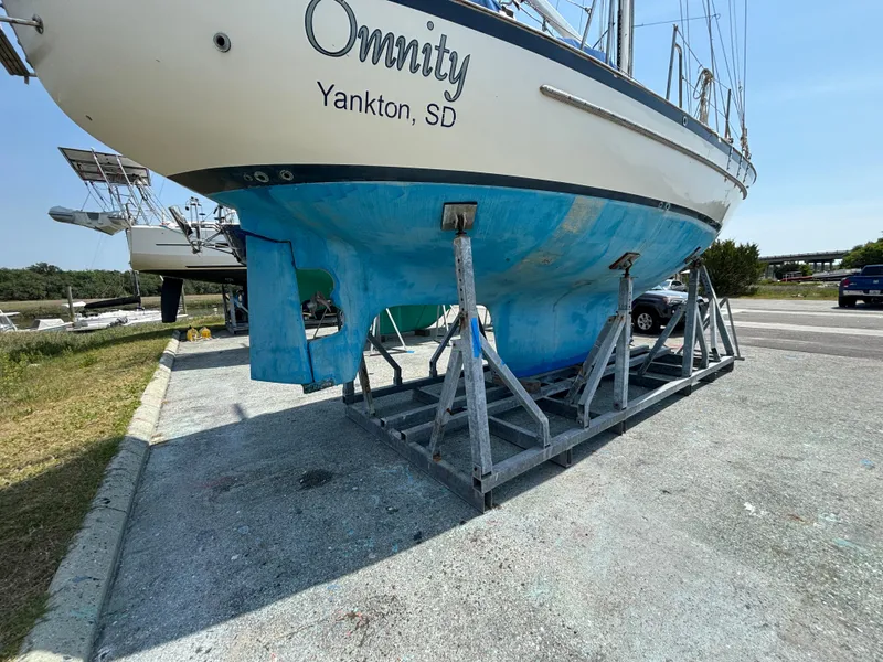 Slide: The Image of 1995 Pacific Seacraft Crealock 37 sailboat on stands, Yankton, SD, blue hull. - 7