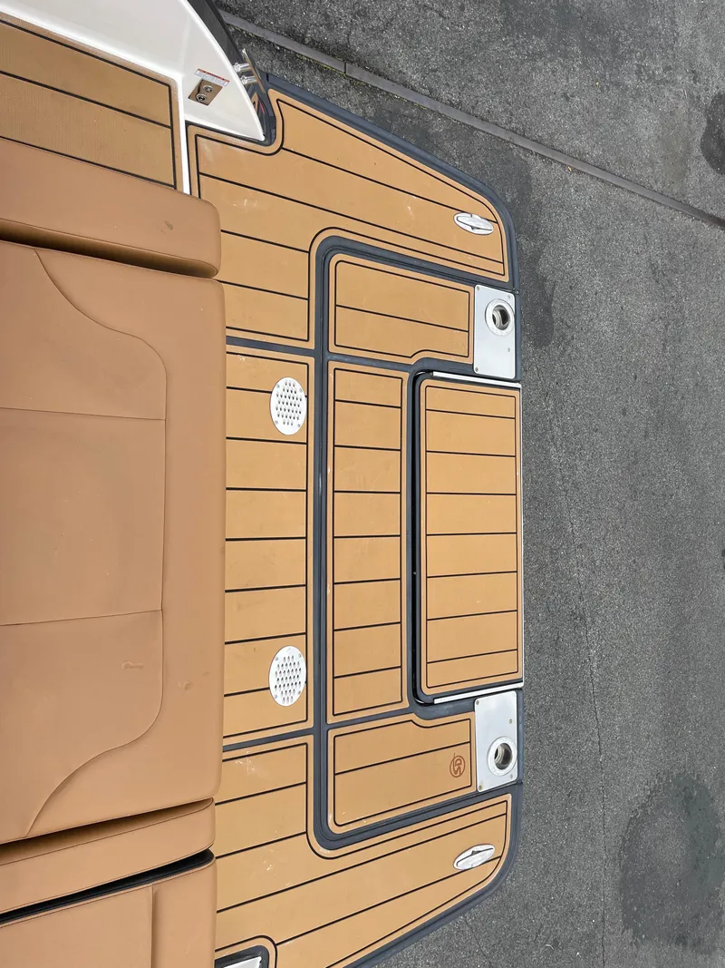 Slide: The Image of 2023 Chaparral 287 SSX boat deck with tan and gray detailing. - 23