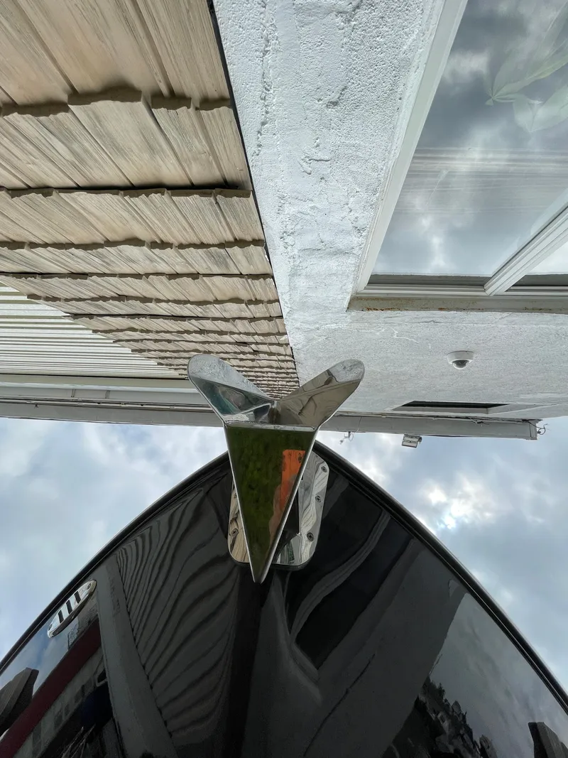 Slide: The Image of 2023 Chaparral 287 SSX boat bow with modern architecture reflection. - 27