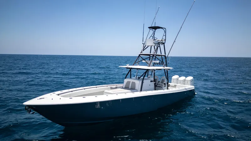 The Image of 2023 Contender 44 CB boat on open sea, clear sky, calm waters. - 1