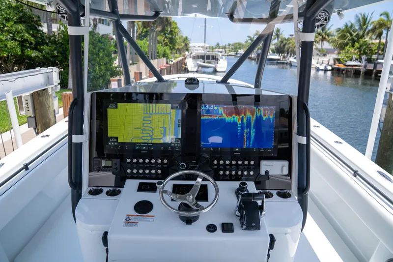 Slide: The Image of 2023 Contender 44 CB boat dashboard with advanced navigation and control systems. - 20