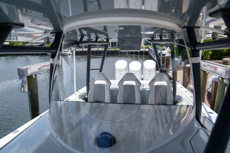 Slide: The Image of 2023 Contender 44 CB boat interior with sleek seating and modern design. - 24