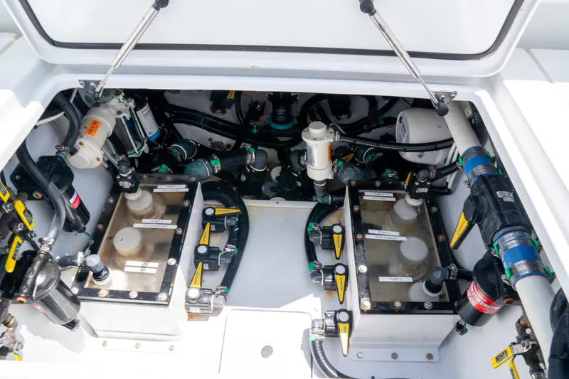 Slide: The Image of Engine compartment of 2023 Contender 44 CB boat, showcasing mechanical components and systems. - 41