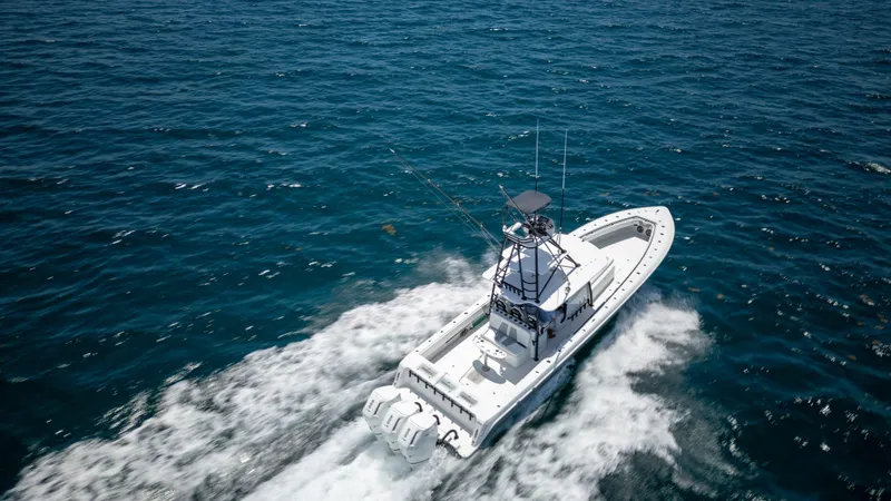 Slide: The Image of 2023 Contender 44 CB boat cruising on open ocean waters. - 8