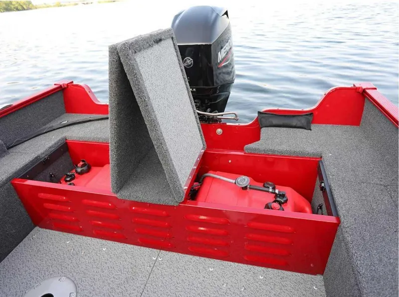 Slide: The Image of 2026 Lund 1650 Angler boat with open storage compartment and visible outboard motor. - 9