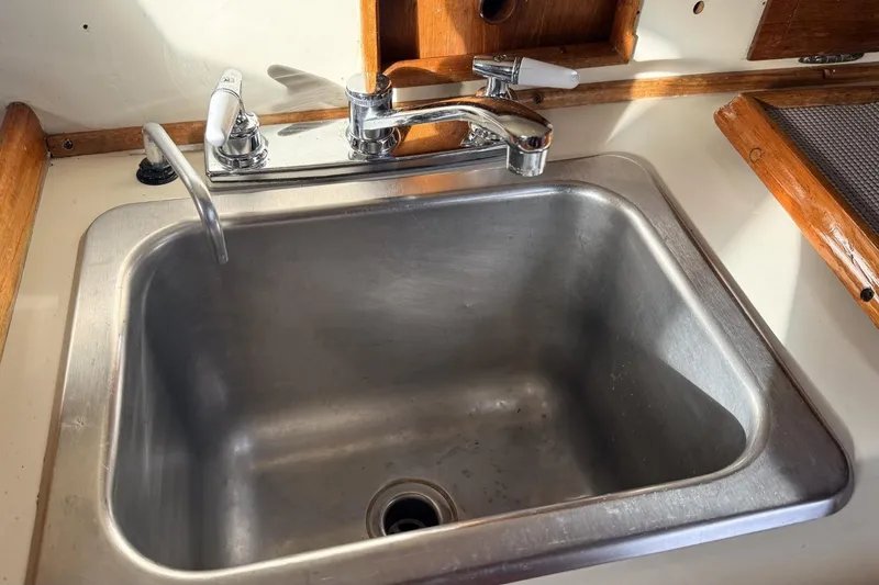 Slide: The Image of Stainless steel sink with faucet in 1979 Ericson 30 Plus boat interior. - 10
