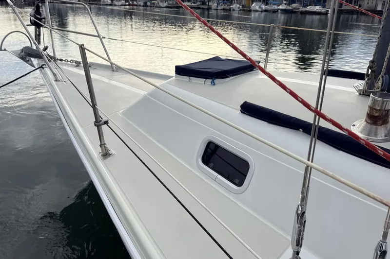 Slide: The Image of 1979 Ericson 30 Plus sailboat deck with sleek design, docked in a marina. - 26
