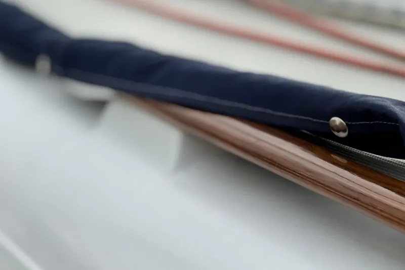 Slide: The Image of Close-up of a 1979 Ericson 30 Plus sailboat's polished wood and covered rigging. - 28