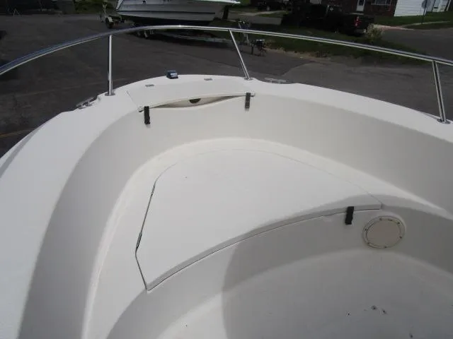 Slide: The Image of 2002 Trophy 1903 CC boat bow with white seating and stainless steel railings. - 10