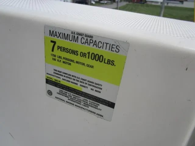 Slide: The Image of Boat capacity label for 2002 Trophy 1903 CC, 7 persons or 1000 lbs limit. - 14