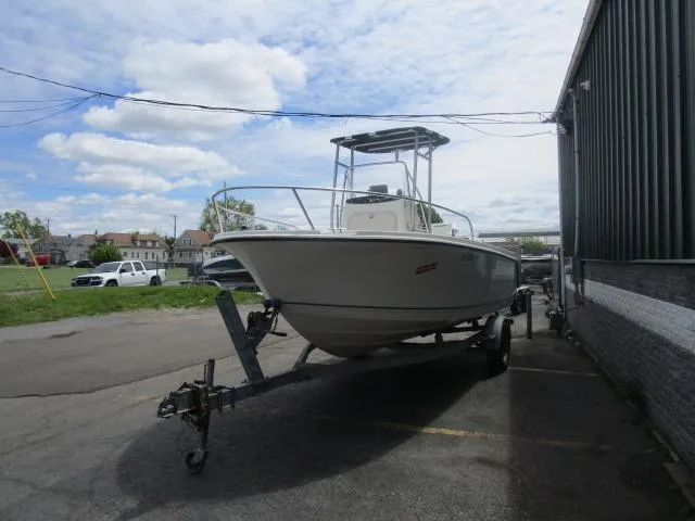 Slide: The Image of 2002 Trophy 1903 CC boat on trailer, parked outdoors under a cloudy sky. - 3