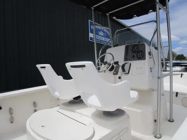 Slide: The Image of 2002 Trophy 1903 CC boat interior with dual white seats and steering console. - 7