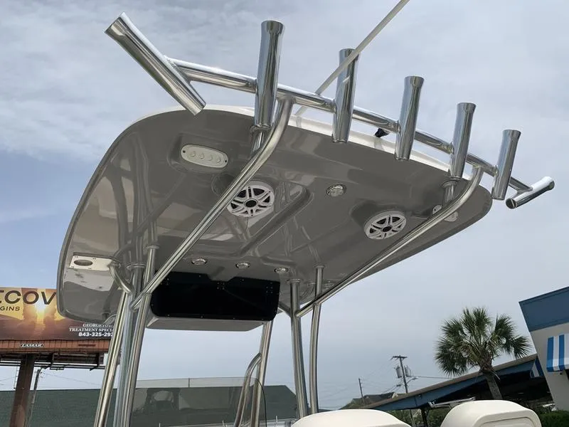Slide: The Image of 2024 Bulls Bay 255CC boat T-top with rod holders and speakers. - 12