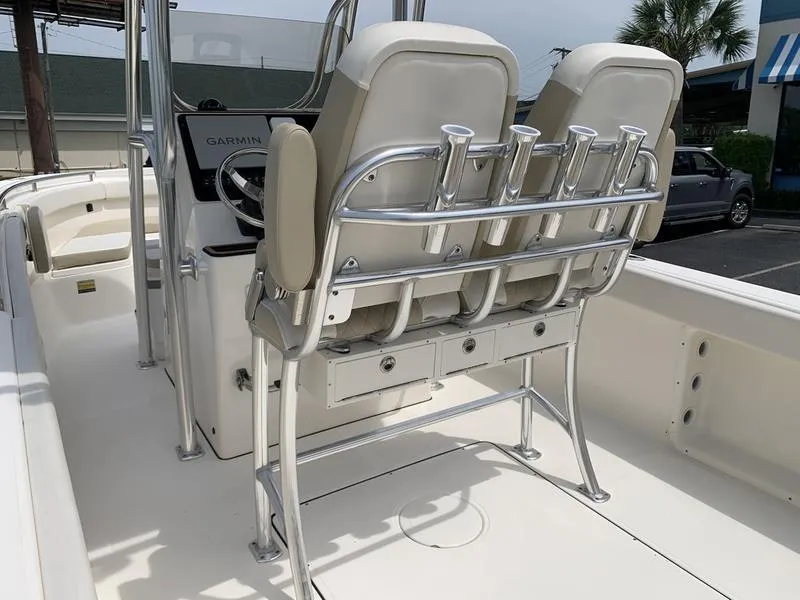 Slide: The Image of 2024 Bulls Bay 255CC boat interior with dual seats and rod holders. - 14