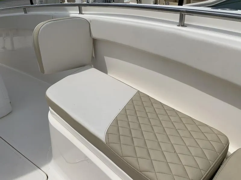 Slide: The Image of 2024 Bulls Bay 255CC boat with beige diamond-stitched seating. - 28