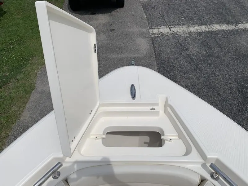 Slide: The Image of 2024 Bulls Bay 255CC boat with open storage compartment on deck. - 29