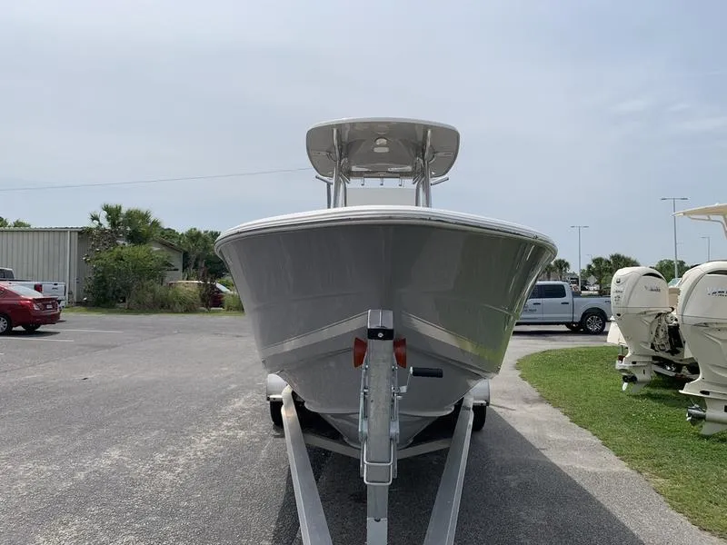 Slide: The Image of 2024 Bulls Bay 255CC boat on trailer, front view, parked outdoors. - 7