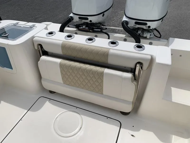 Slide: The Image of 2024 Bulls Bay 255CC boat with foldable seating and dual outboard motors. - 9