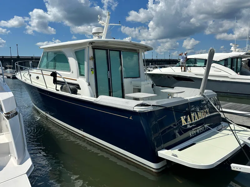 Slide: The Image of 2020 Back Cove 41 yacht docked at marina under blue sky. - 0