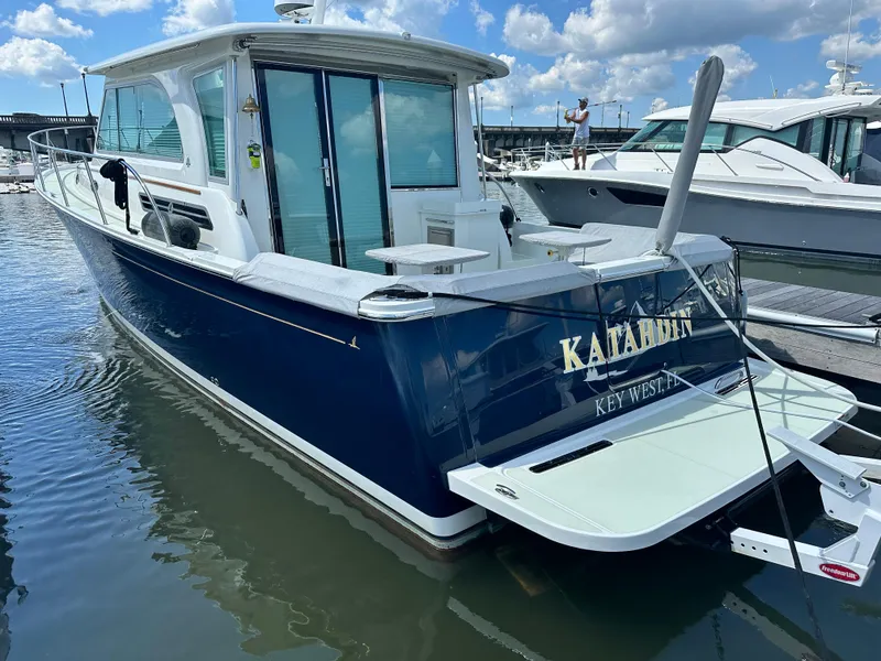 Slide: The Image of 2020 Back Cove 41 boat docked, featuring sleek design and spacious deck. - 1