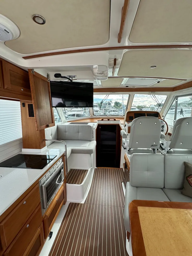 Slide: The Image of Interior of 2020 Back Cove 41 yacht with modern kitchen and seating area. - 12