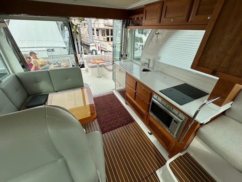 Slide: The Image of Interior of 2020 Back Cove 41 yacht with modern kitchen and seating area. - 14