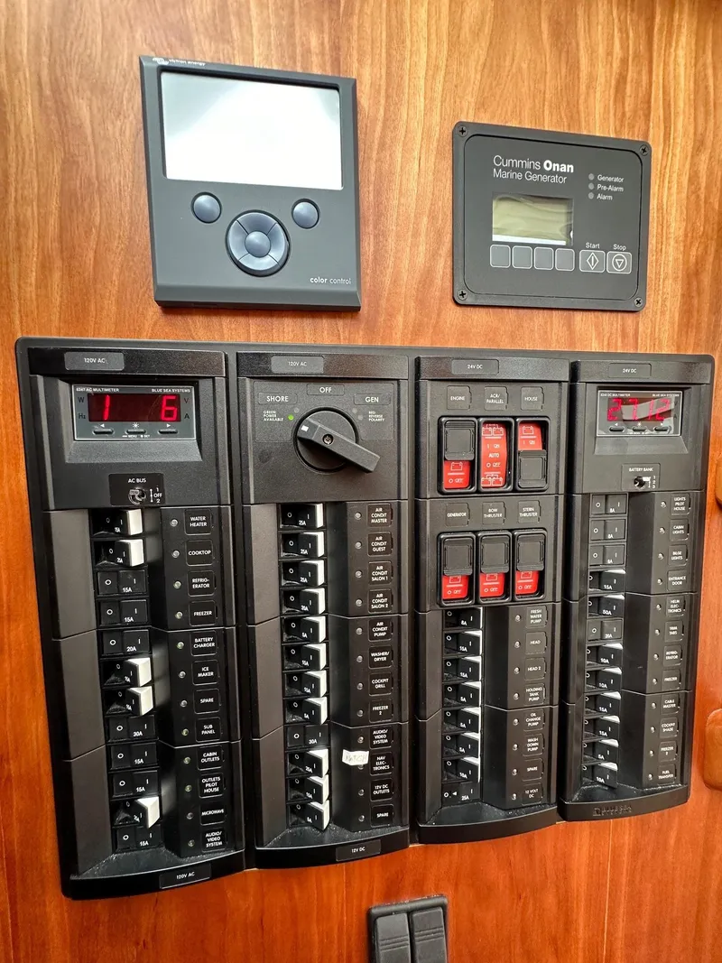 Slide: The Image of Electrical control panel on a 2020 Back Cove 41 boat, featuring Cummins Onan display. - 20
