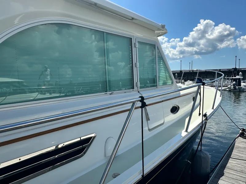 Slide: The Image of 2020 Back Cove 41 yacht docked under a clear blue sky. - 22