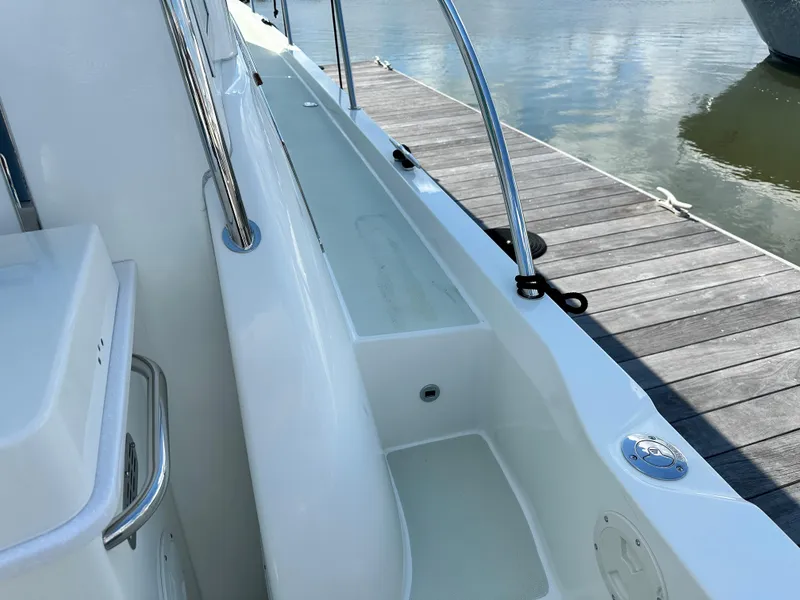 Slide: The Image of 2020 Back Cove 41 yacht docked, showcasing sleek white deck and stainless steel railings. - 27