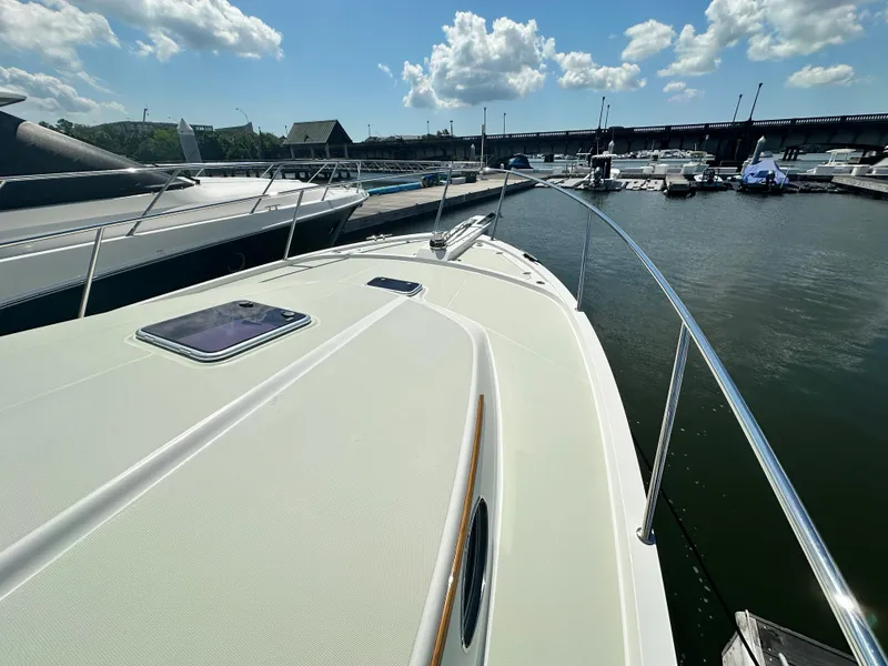 Slide: The Image of Back Cove 41 yacht docked at marina, 2020 model, sunny day, calm water. - 31
