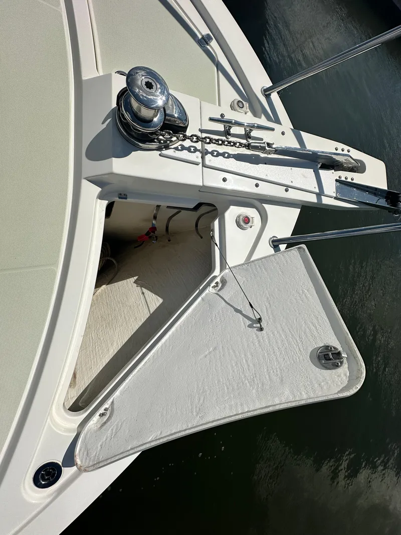 Slide: The Image of 2020 Back Cove 41 boat anchor system with open hatch and winch. - 34