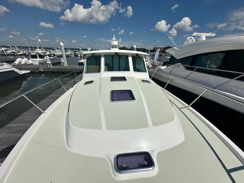 Slide: The Image of 2020 Back Cove 41 yacht docked at marina under blue sky. - 36