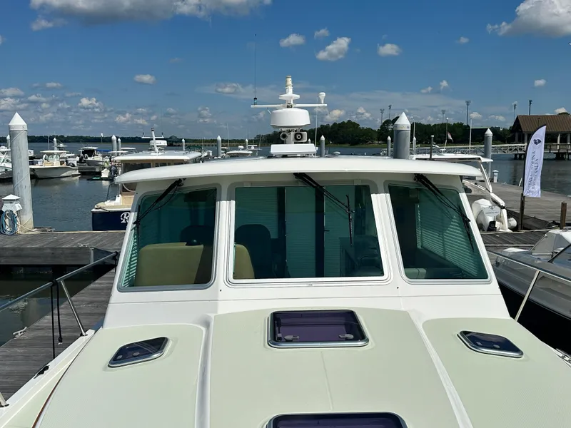 Slide: The Image of 2020 Back Cove 41 yacht docked at marina under clear blue sky. - 37