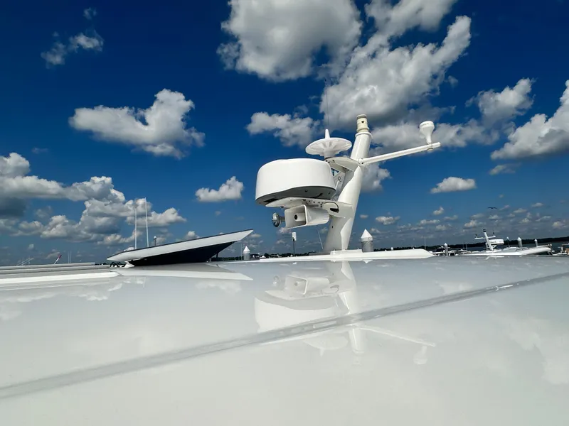 Slide: The Image of 2020 Back Cove 41 yacht radar against a vibrant blue sky with clouds. - 45